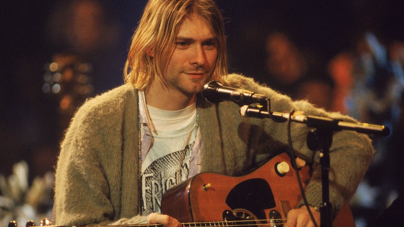 Kurt Cobain à frente do Nirvana em cena do DVD MTV Unplugged