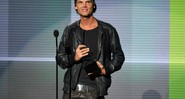 Avicii recebe o prêmio de artista favorito - dance music eletrônica no American Music Awards, em 2013, no Nokia Theatre L.A. Live, em Los Angeles - John Shearer/Invision/AP